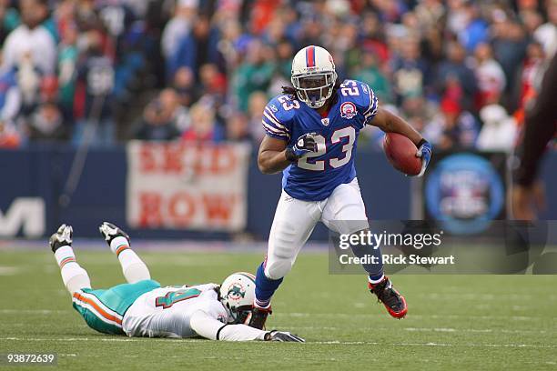 Marshawn Lynch of the Buffalo Bills runs past Sean Smith of the Miami Dolphins at Ralph Wilson Stadium on November 29, 2009 in Orchard Park, New...