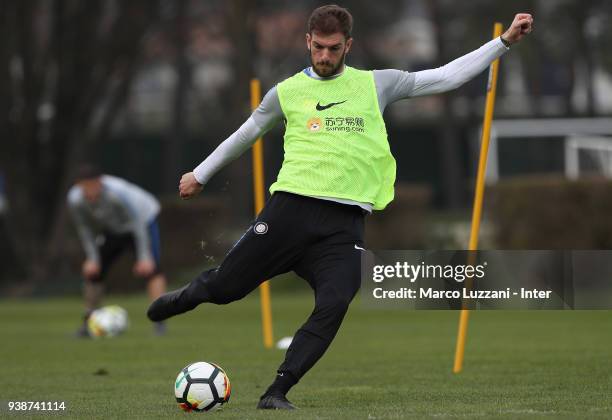 Davide Santon of FC Internazionale kicks a ball during the FC Internazionale training session at the Angelo Moratti Sports Centre on March 27, 2018...