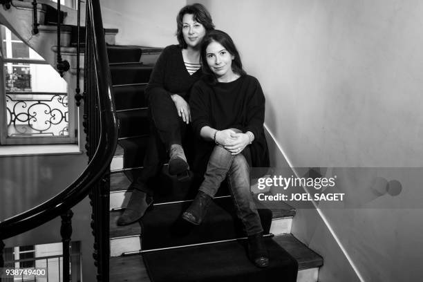 French comic book artist Catel Muller poses with French writer Anne Goscinny during a photo session in Paris on March 26, 2018. - Muller and Goscinny...