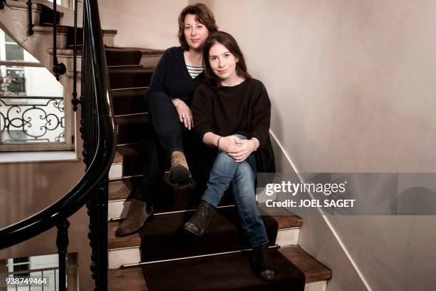 French comic book artist Catel Muller poses with French writer Anne Goscinny during a photo session in Paris on March 26, 2018. - Muller and Goscinny...