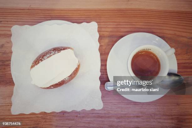 high angle view of italian breakfast on table. coffee with dessert (maritozzo) - roma capucino stock pictures, royalty-free photos & images