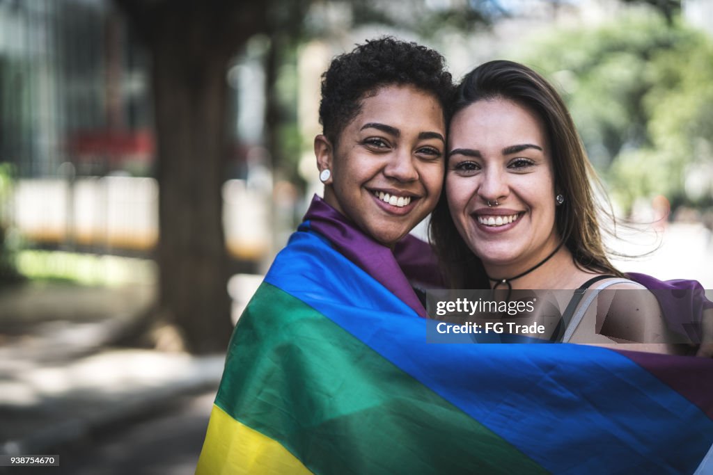 Lesbian Couple with Rainbow Flag