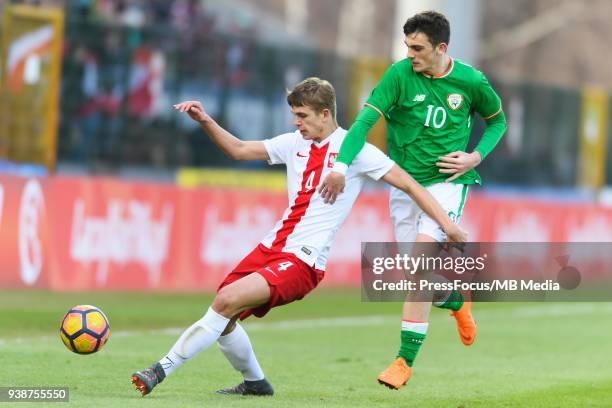 Maik Nawrocki of Poland competes with Troy Parrot of Republic of Ireland during UEFA Under-17 Championship Elite Round Group 3 match between Poland...