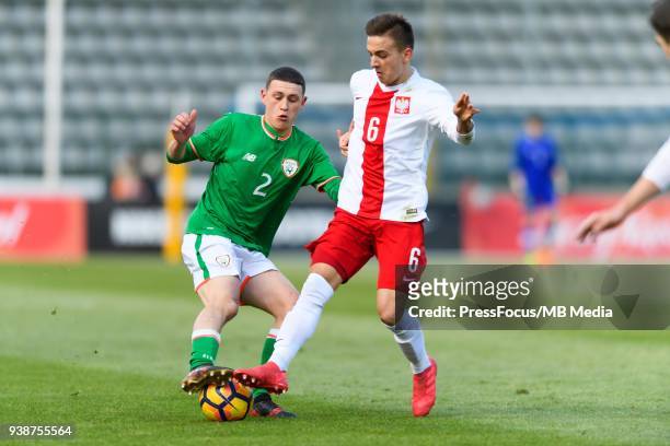 Max Murphy of Republic of Ireland competes with Michal Karbownik of Poland during UEFA Under-17 Championship Elite Round Group 3 match between Poland...