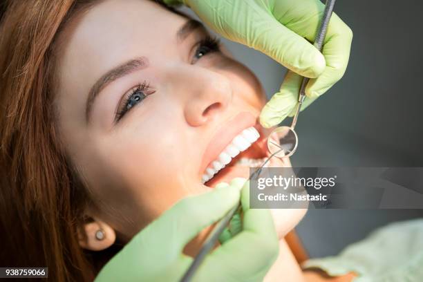 young woman at dentist - white teeth stock pictures, royalty-free photos & images