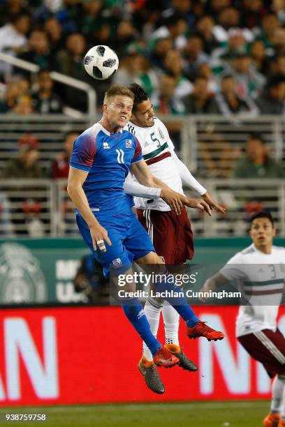 Bjorn Siguroarson of Iceland competes for the ball against Diego Reyes of Mexico during their match at Levi's Stadium on March 23, 2018 in Santa...