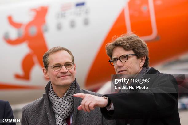 Berlin's Mayor Michael Mueller and Chief of Berlin-Brandenburg Airport society Engelbert Luetke Daldrup are pictured in front of an easyJet plane...