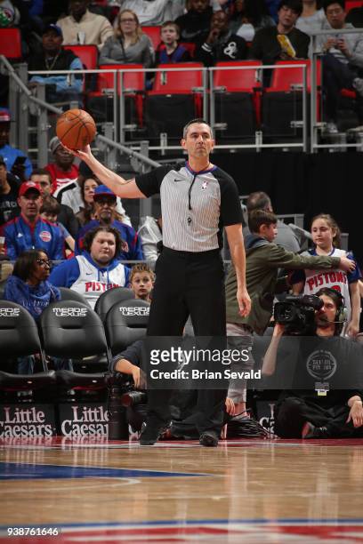 Referee, Brett Nansel holds the ball during the Los Angeles Lakers game against the Detroit Pistons on March 26, 2018 at Little Caesars Arena in...
