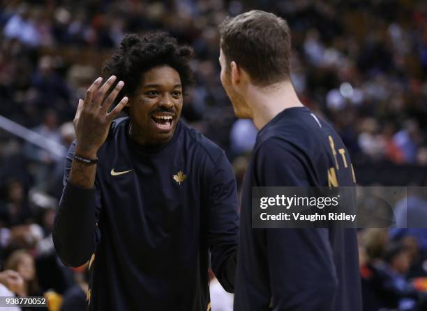 Lucas Nogueira and Jakob Poeltl of the Toronto Raptors talk during warm up, prior to the first half of an NBA game against the Brooklyn Nets at Air...