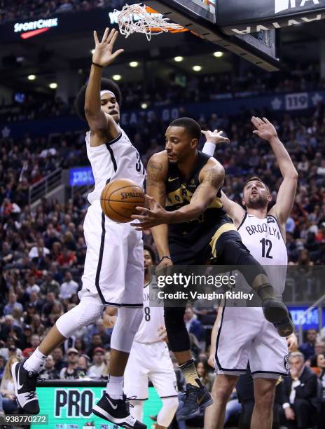 Norman Powell of the Toronto Raptors passes the ball as Jarrett Allen of the Brooklyn Nets defends during the first half of an NBA game at Air Canada...