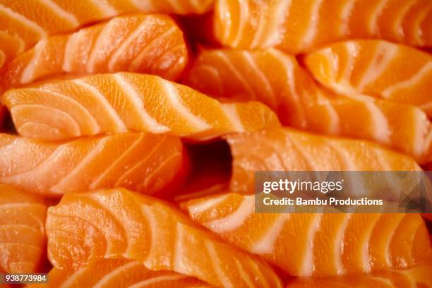 japanese restaurant showcase with fresh salmon - sashimi stock pictures, royalty-free photos & images