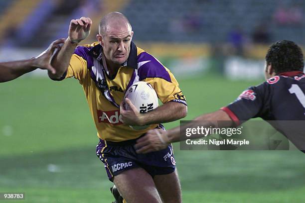 Matt Geyer of the Storm tries to break through the Warriors defence during the National Rugby League Match between the New Zealand Warriors and the...