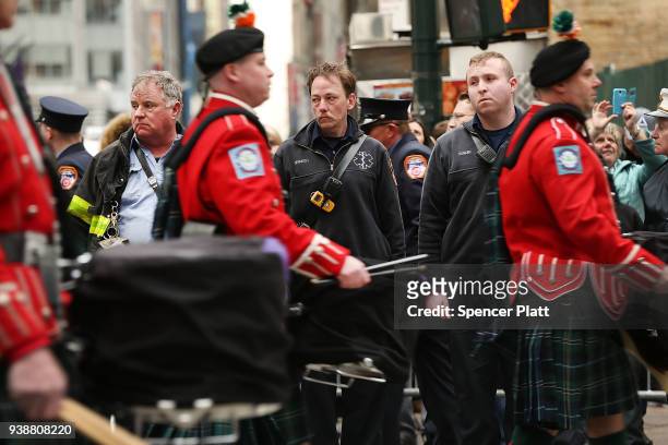 Members of the fire department watch the funeral procession for New York City firefighter Lt. Michael Davidson at St. Patrick's Cathedral on March...