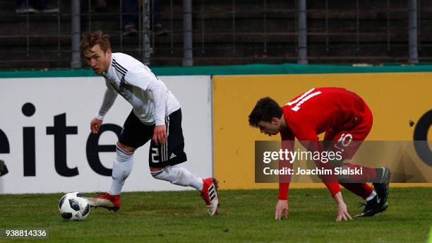 Felix Passlack of Germany challenges Adam Ryczkowski of Poland during the international friendly match between U20 Germany and U20 Poland at...