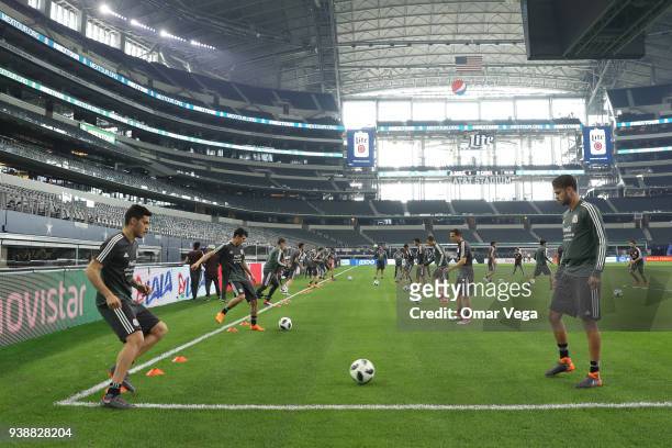 Diego Reyes and Raul Jimenez of Mexico warm up during the Mexico training session ahead of the FIFA friendly match against Croatia at AT&T Stadium on...