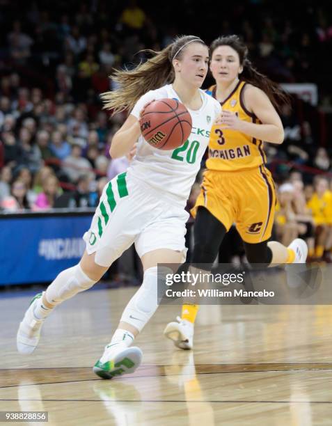 Sabrina Ionescu of the Oregon Ducks drives against Presley Hudson of the Central Michigan Chippewas during the 2018 NCAA Division 1 Women's...