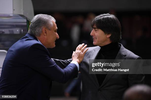 Tite, Manager of Brazil, greets Joachim Low, Manager of Germany prior to the International friendly between Germany and Brazil at Olympiastadion on...