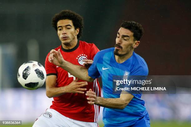 Egypt's Omar Gaber vies with Lazaros Christodoulopoulos from Greece during the international friendly football match between Egypt and Greece at the...