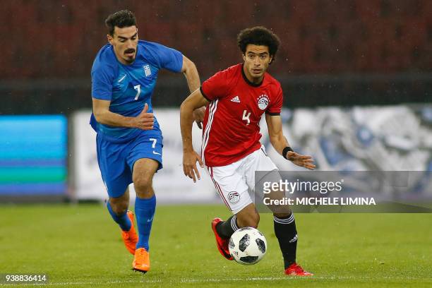 Egypt's Omar Gaber vies with Lazaros Christodoulopoulos from Greece during the international friendly football match between Egypt and Greece at the...