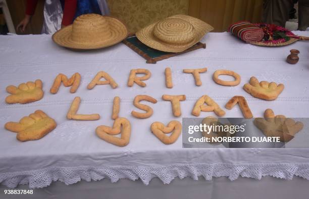 Picture of letter-shaped chipas -Paraguay's traditional cheese bread rolls- reading "Marito. List 1" taken during a chipa contest organized by...