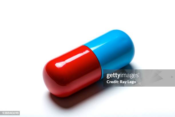 big fake pill with small drop shadow on white background - drop shadow stock pictures, royalty-free photos & images
