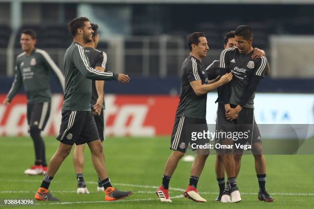 Diego Reyes and Andres Guardado of Mexico joke during the Mexico training session ahead of the FIFA friendly match against Croatia at AT&T Stadium on...