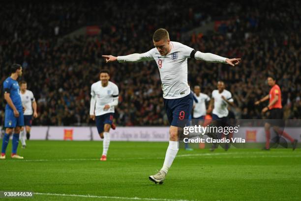 Jamie Vardy of England celebrates after scoring the opening goal during the friendly match between England and Italy at Wembley Stadium on March 27,...