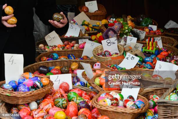 Hand made traditional hand painted Easter eggs and baskets on display for sale on Krakow's Easter market. Originating as a pagan tradition, pisanki...