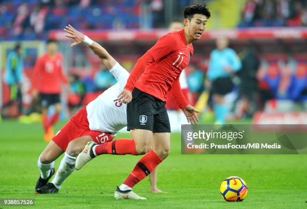 Lee Keun-Ho of Korea Republic competes with Kamil Glik of Poland during international friendly match between Poland and Korea Republic at Slaski...