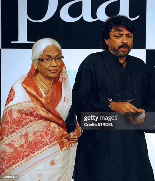 Indian director Sanjay Bhansali escorts his mother Leela Bhansali at the premiere of the Bollywood Hindi film �Paa� in Mumbai late December 3, 2009....