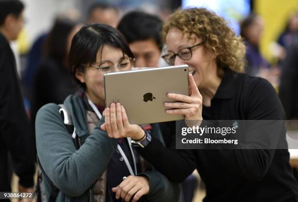 Attendees view a new Apple Inc. IPad in a technology lab during an event at Lane Technical College Prep High School in Chicago, Illinois, U.S., on...