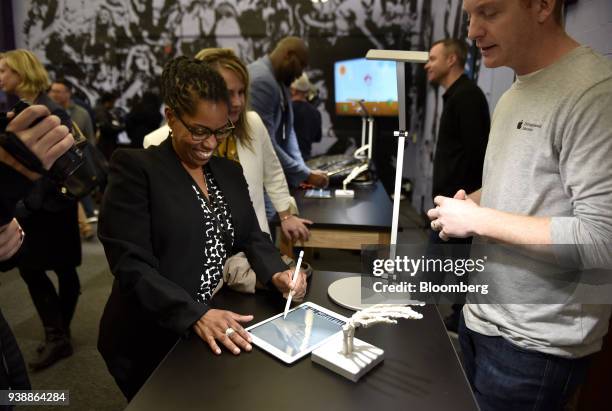 An attendee demonstrates a new Apple Inc. IPad and Apple Pencil in a technology lab during an event at Lane Technical College Prep High School in...