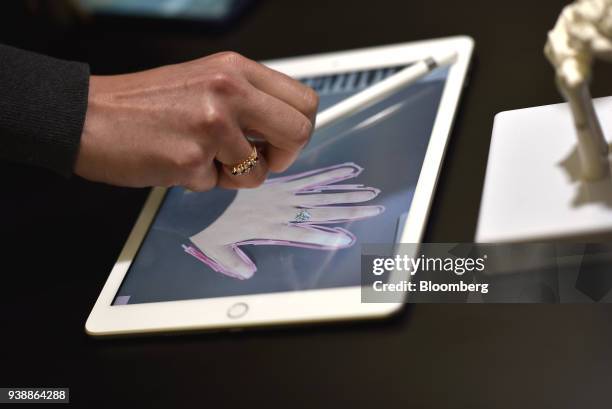 An attendee demonstrates a new Apple Inc. IPad and Apple Pencil in a technology lab during an event at Lane Technical College Prep High School in...