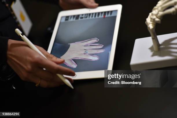 An attendee demonstrates a new Apple Inc. IPad and Apple Pencil in a technology lab during an event at Lane Technical College Prep High School in...