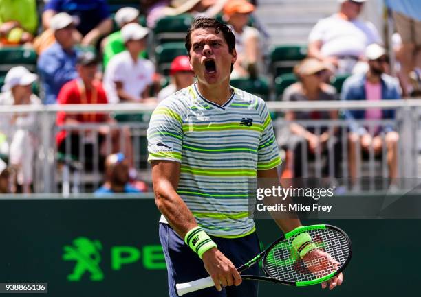 Milos Raonic of Canada celebrates beating Jeremy Chardy of France 6-3 6-4 during Day 9 of the Miami Open Presented by Itau at Crandon Park Tennis...