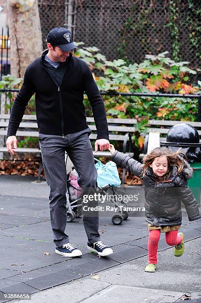 Actor Hugh Jackman and his daughter Ava Jackman play in Greenwich Village on December 03, 2009 in New York City.