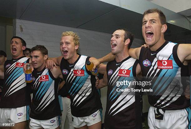 Port Adelaide players sing the club song after winning the match between the Adelaide Crows and Port Adelaide Power in round 5 of the AFL played at...