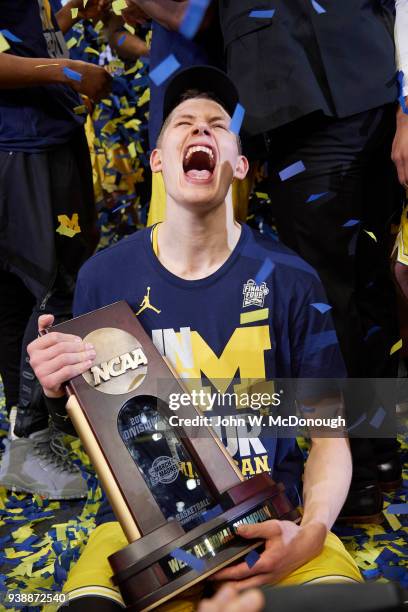 Playoffs: Michigan Moritz Wagner victorious holding West Regional Championship trophy after winning game vs Florida State at Staples Center. Los...