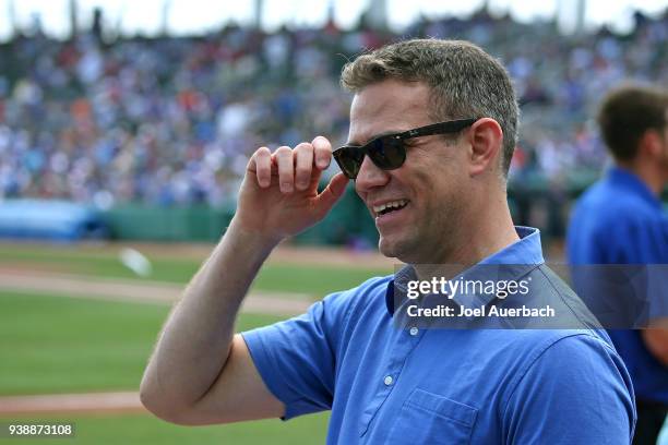Theo Epstein, President of Baseball Operations for the Chicago Cubs looks on prior to the spring training game against the Boston Red Sox at JetBlue...