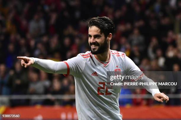 Spain's midfielder Isco celebrates after scoring his team's third goal during a friendly football match between Spain and Argentina at the Wanda...