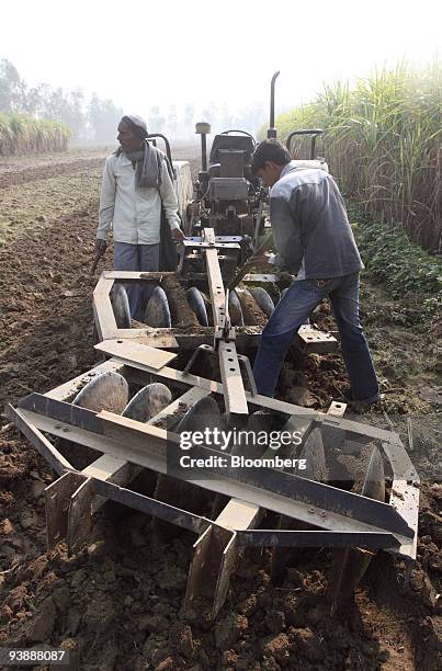Farmers disk their wheat field in the village of Bijnor, India, on Thursday, Dec. 3, 2009. India, the world's second-biggest producer of wheat, said...