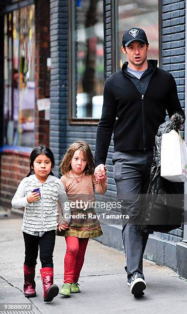 Actor Hugh Jackman and his daughter Ava Jackman walk in Greenwich Village on December 03, 2009 in New York City.