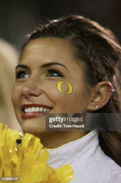 An Oregon Ducks cheerleader smiles after her team's 33-37 victory over the Oregon State Beavers at Autzen Stadium on December 3, 2009 in Eugene,...