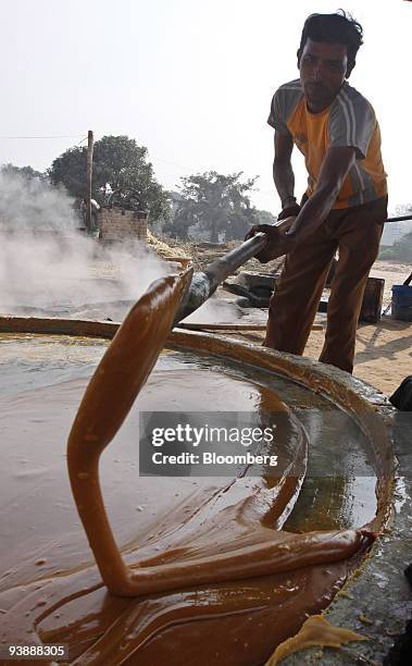 Worker prepares jaggery from sugarcane juice in the village of Bijnor, India, on Thursday, Dec. 3, 2009. India, the world's second-biggest producer...