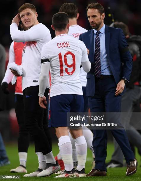 Gareth Southgate, Manager of England with Lewis Cook of England after the International friendly between England and Italy at Wembley Stadium on...
