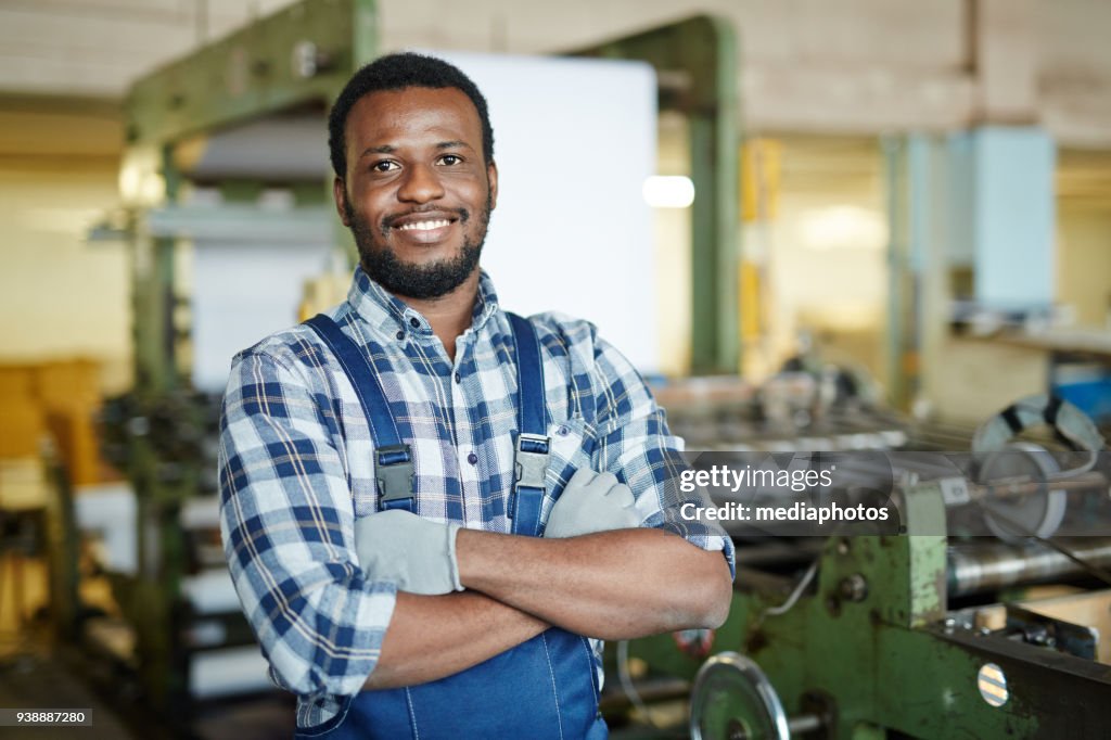 Positive repairman examining printing machine