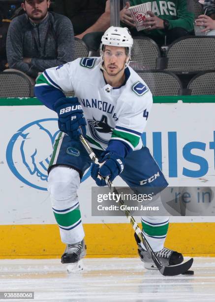 Michael Del Zotto of the Vancouver Canucks handles the puck against the Dallas Stars at the American Airlines Center on March 25, 2018 in Dallas,...