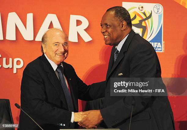 President Joseph S. Blatter greets Confederation of African Football President Issa Hayatou at the FIFA 2010 World Cup Team Seminar at the Cape Town...