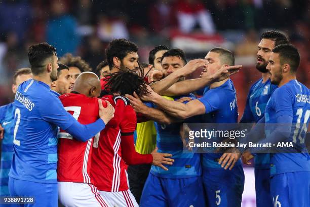 Kyriakos Papadopolous of Greece grabs Mohamed Elneny of Egypt by the hair during the International Friendly match between Egypt and Greece at Stadion...