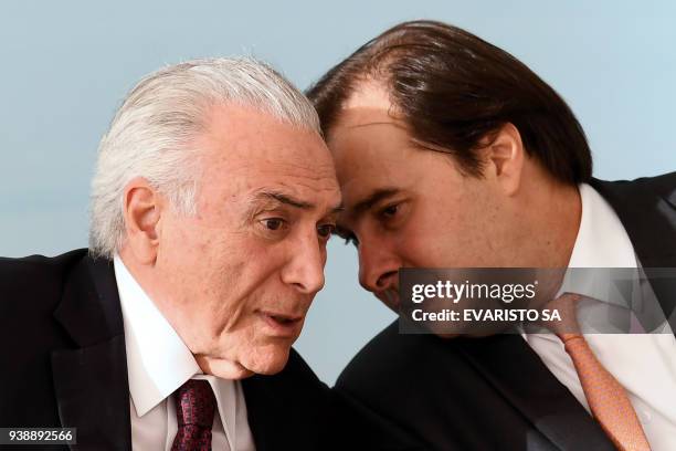 Brazilian President Michel Temer and the head of the Brazilian Chamber of Deputies Rodrigo Maia, chat during the ceremony to grant the Order of...